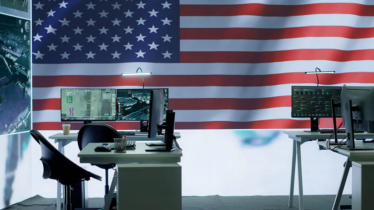computers with American flag in background